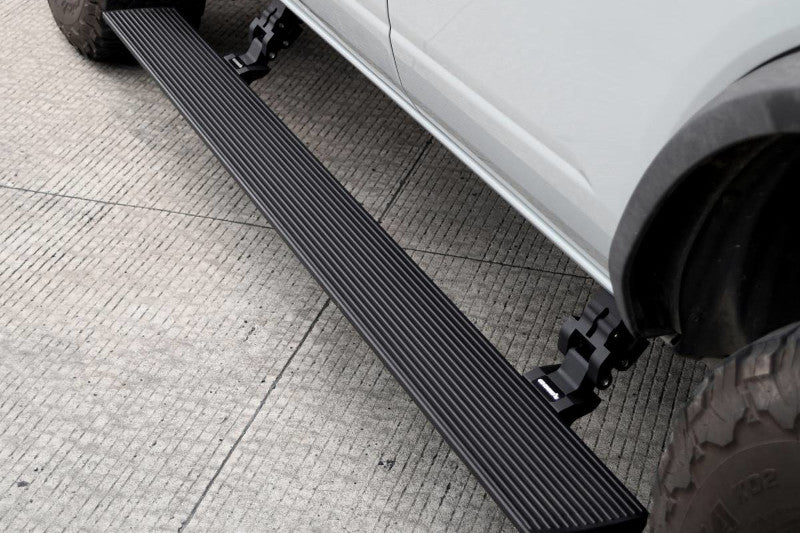 Go Rhino 20410680T E1 Electric Running Board Kit (Bedliner) | 2009-2023 Ram 1500 Extended Cab